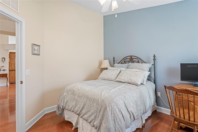 12071 Wexford Blvd, Spring Hill, FL 34609 - bedroom with wood finished floors, baseboards, and a ceiling fan