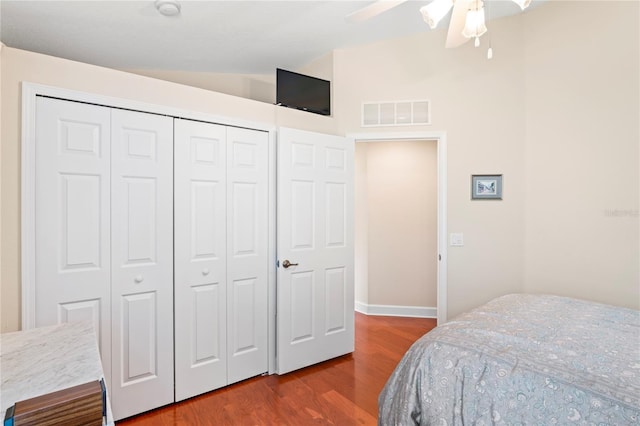 12071 Wexford Blvd, Spring Hill, FL 34609 - bedroom featuring wood finished floors, lofted ceiling, a closet, a ceiling fan, and baseboards