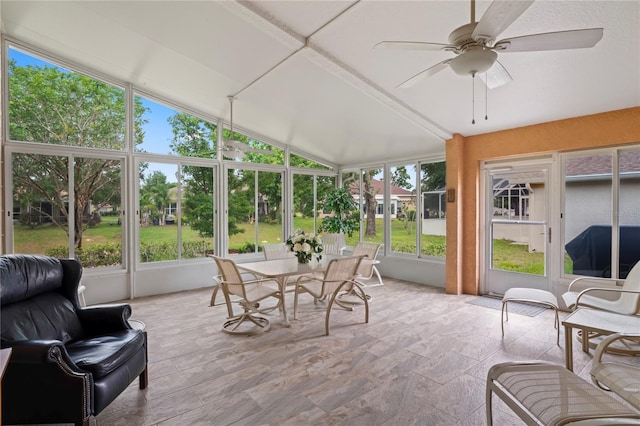 12071 Wexford Blvd, Spring Hill, FL 34609 - sunroom / solarium with ceiling fan, lofted ceiling, stone finish flooring, and outdoor dining area