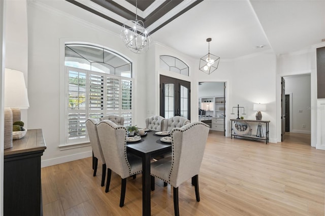 15413 Azra Dr, Odessa, FL 33556 - dining space featuring a chandelier, ornamental molding, light wood finished floors, and baseboards