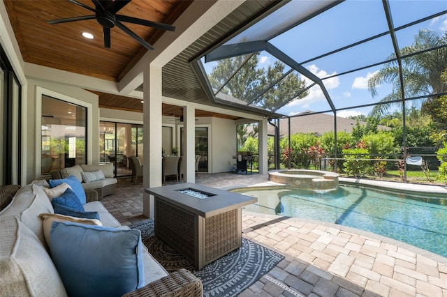 15413 Azra Dr, Odessa, FL 33556 - view of swimming pool featuring an outdoor living space with a fire pit, a ceiling fan, a patio, and a pool with connected hot tub