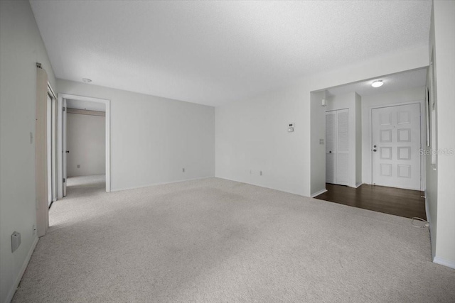 spare room featuring carpet flooring