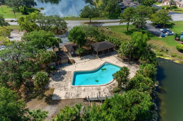 aerial view of a pool and a nearby body of water
