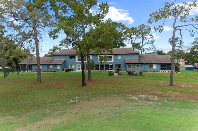 view of front of house with a front lawn and stucco siding