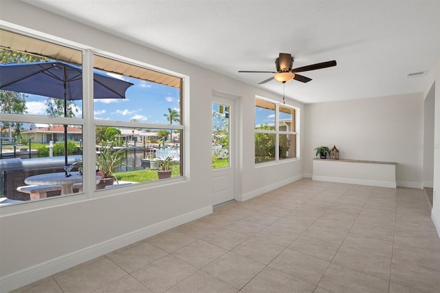 4937 Dory Dr, New Port Richey, FL 34652 - unfurnished sunroom with a water view