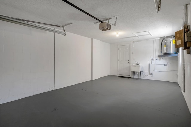 4937 Dory Dr, New Port Richey, FL 34652 - garage featuring a garage door opener and electric water heater