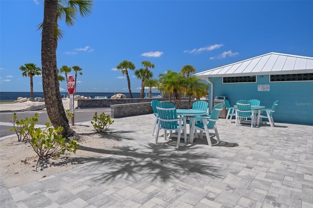 4937 Dory Dr, New Port Richey, FL 34652 - view of patio with outdoor dining area and a water view