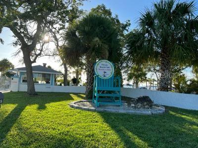 4937 Dory Dr, New Port Richey, FL 34652 - view of home's community with a lawn