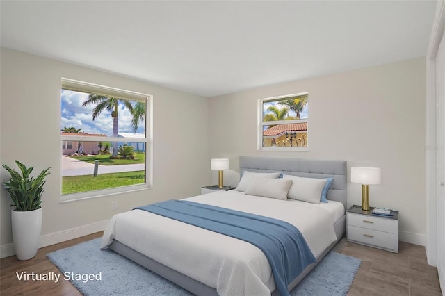 4937 Dory Dr, New Port Richey, FL 34652 - bedroom with baseboards and light wood finished floors