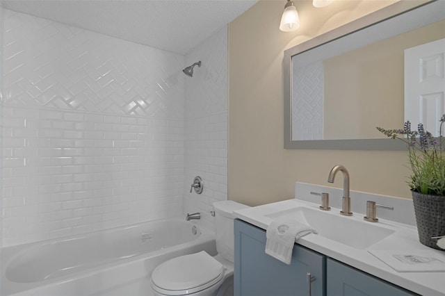 4937 Dory Dr, New Port Richey, FL 34652 - full bath with toilet, bathtub / shower combination, a textured ceiling, and vanity