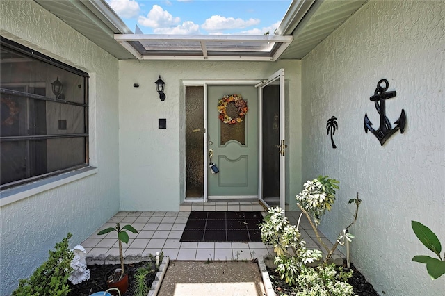 doorway to property with stucco siding