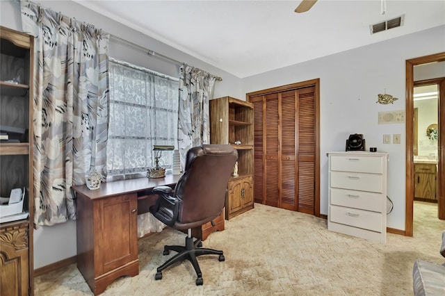 office space featuring carpet flooring, baseboards, and ceiling fan