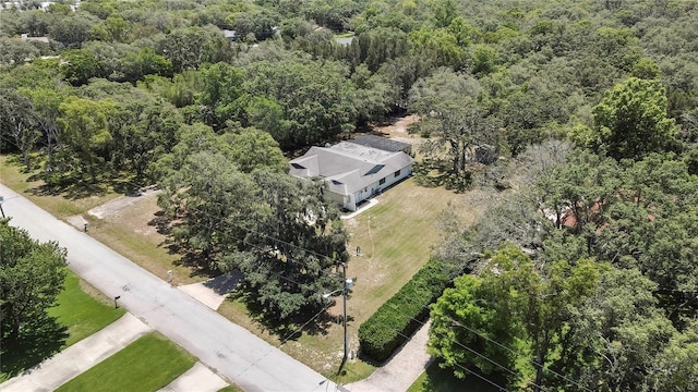 view from above of property featuring a heavily wooded area