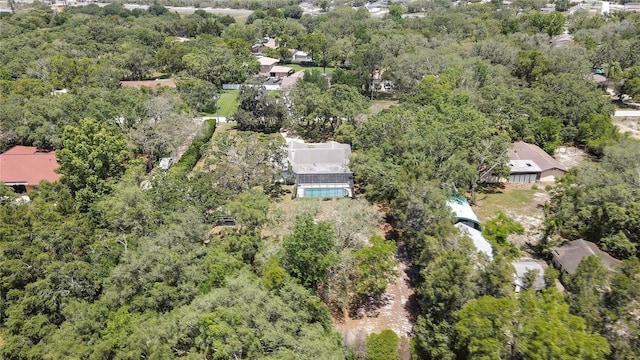 aerial overview of property's location with a forest