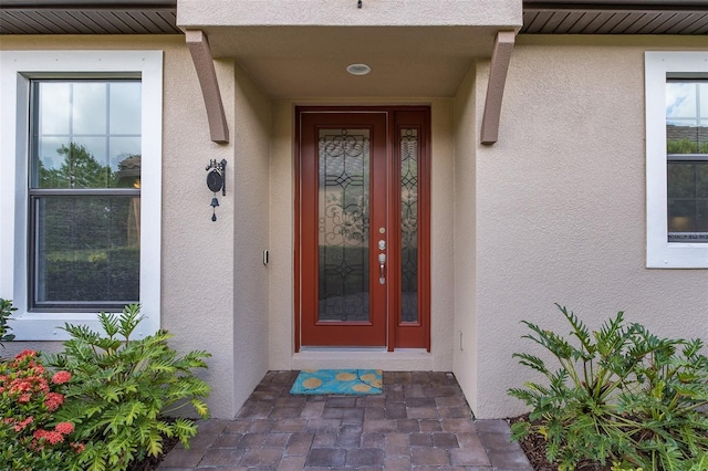11611 Callisia Dr, Odessa, FL 33556 - view of exterior entry with stucco siding