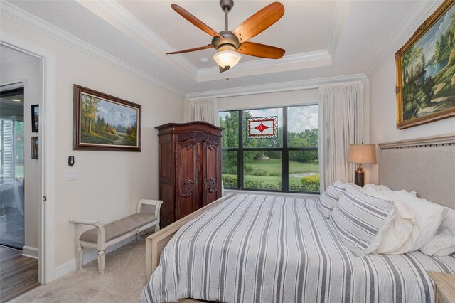 11611 Callisia Dr, Odessa, FL 33556 - bedroom featuring a raised ceiling, ornamental molding, ceiling fan, carpet floors, and baseboards
