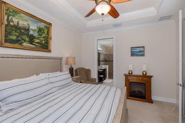 11611 Callisia Dr, Odessa, FL 33556 - bedroom featuring light colored carpet, a tray ceiling, ornamental molding, a fireplace, and a ceiling fan