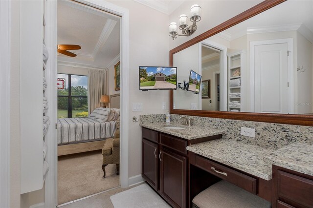 11611 Callisia Dr, Odessa, FL 33556 - bathroom with crown molding, ensuite bath, vanity, ceiling fan, and baseboards