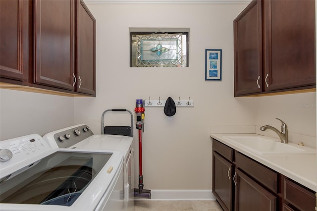11611 Callisia Dr, Odessa, FL 33556 - clothes washing area featuring cabinet space, washing machine and clothes dryer, and baseboards