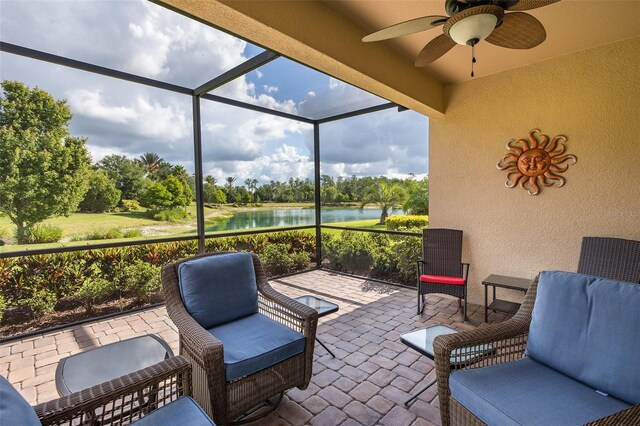 11611 Callisia Dr, Odessa, FL 33556 - view of patio / terrace featuring a water view, ceiling fan, view of wooded area, and glass enclosure