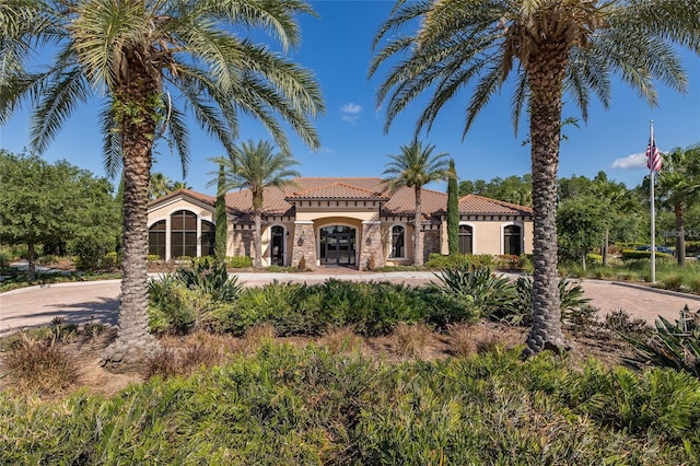 11611 Callisia Dr, Odessa, FL 33556 - mediterranean / spanish house with a tiled roof, stucco siding, and curved driveway