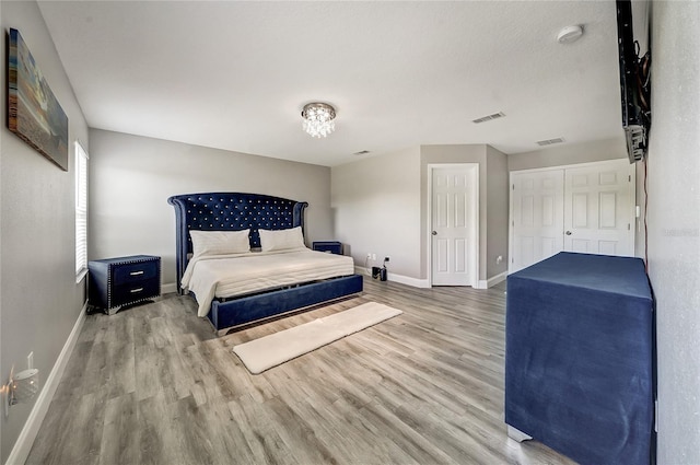 6222 Cherry Blossom Trl, Gibsonton, FL 33534 - bedroom with baseboards and wood finished floors