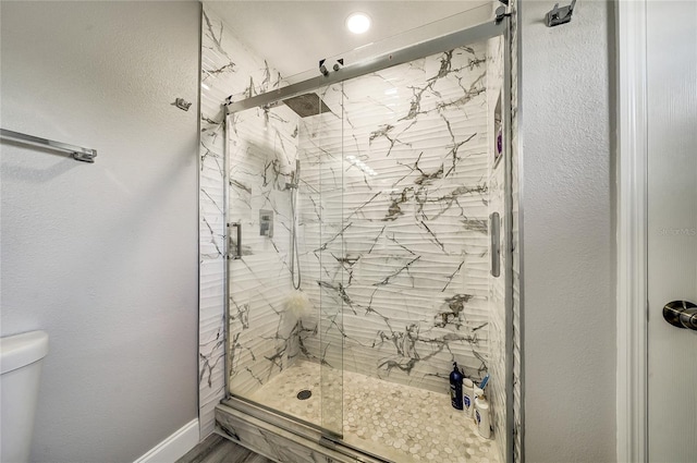 6222 Cherry Blossom Trl, Gibsonton, FL 33534 - full bathroom with toilet, a marble finish shower, and baseboards