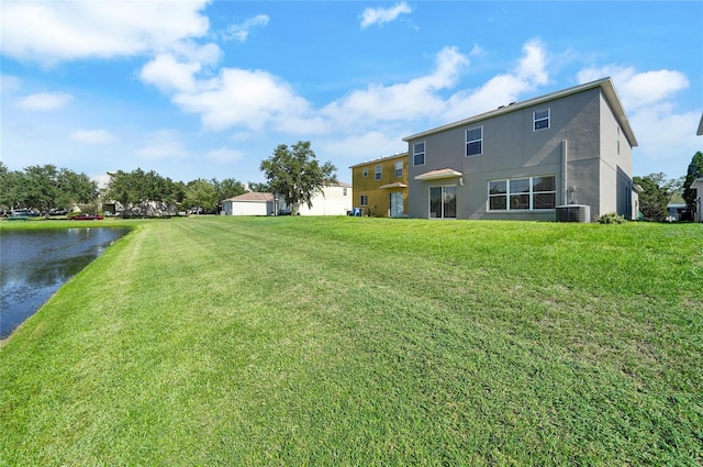 6222 Cherry Blossom Trl, Gibsonton, FL 33534 - view of green lawn with a water view and central air condition unit