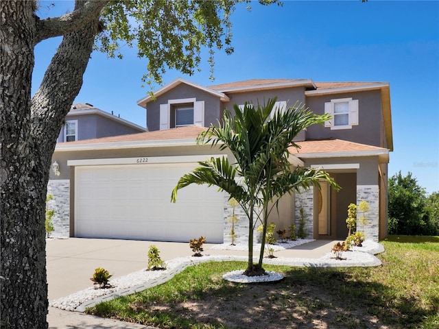 6222 Cherry Blossom Trl, Gibsonton, FL 33534 - view of front of property featuring stucco siding, driveway, and an attached garage