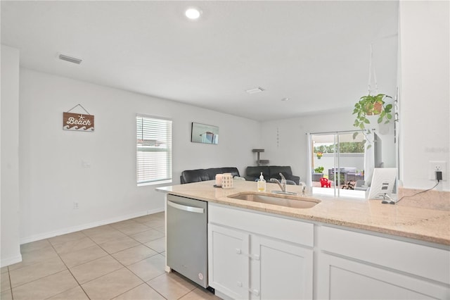kitchen with dishwasher, a sink, white cabinetry, healthy amount of natural light, and recessed lighting