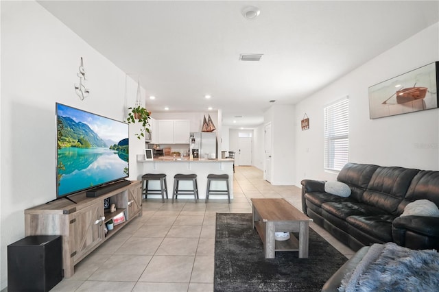 living room featuring light tile patterned floors and recessed lighting
