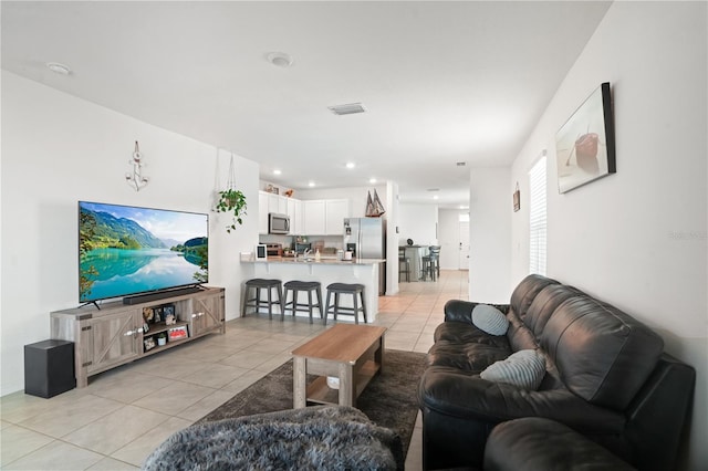 living room with light tile patterned flooring