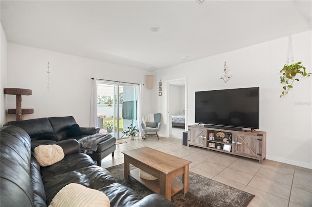 living room with light tile patterned floors and baseboards