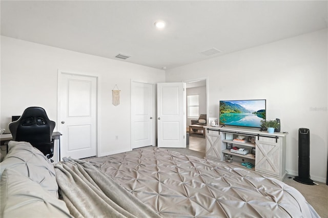 bedroom featuring baseboards and two closets