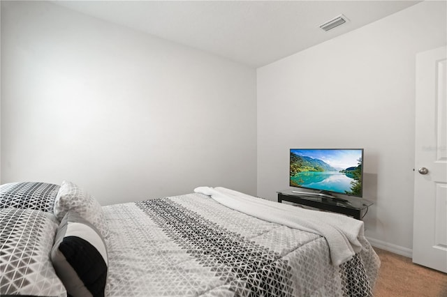 carpeted bedroom with baseboards
