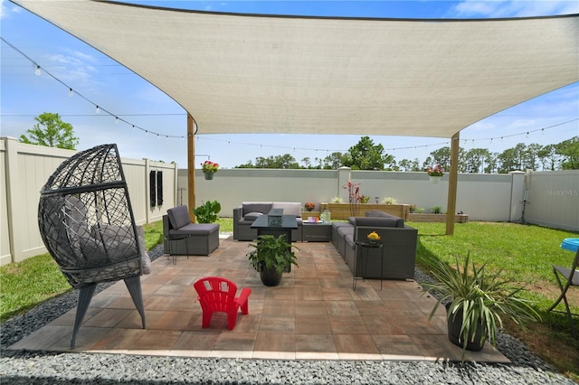 view of patio featuring an outdoor living space and a fenced backyard