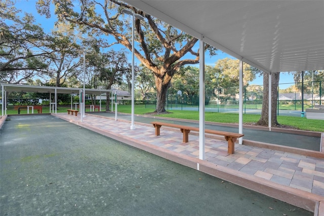 surrounding community with a game area and fence