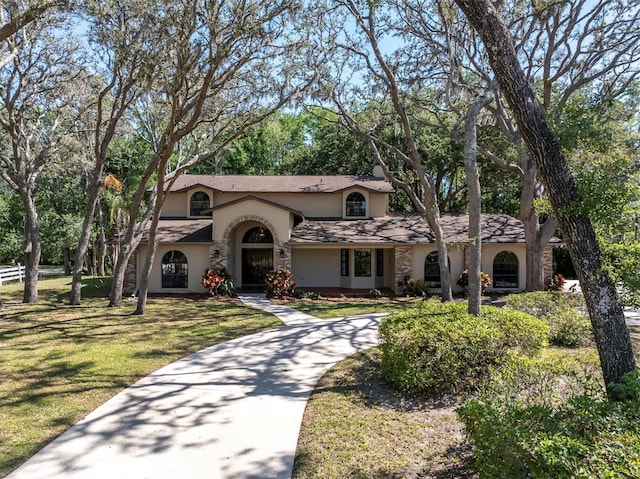 6454 Summerfield Loop, New Port Richey, FL 34655 - view of front of property with stucco siding, a front lawn, and driveway