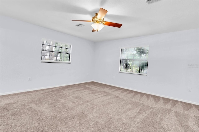 6454 Summerfield Loop, New Port Richey, FL 34655 - carpeted spare room featuring plenty of natural light, a ceiling fan, and baseboards
