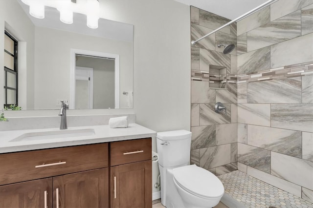 6454 Summerfield Loop, New Port Richey, FL 34655 - full bathroom with a tile shower, vanity, and toilet