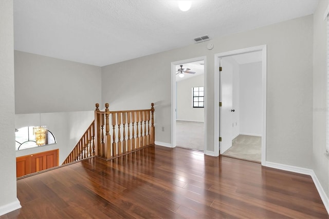 6454 Summerfield Loop, New Port Richey, FL 34655 - empty room featuring wood finished floors, a ceiling fan, baseboards, and a textured ceiling