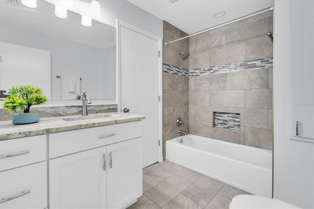 6454 Summerfield Loop, New Port Richey, FL 34655 - bathroom featuring bathing tub / shower combination, vanity, tile patterned flooring, and toilet