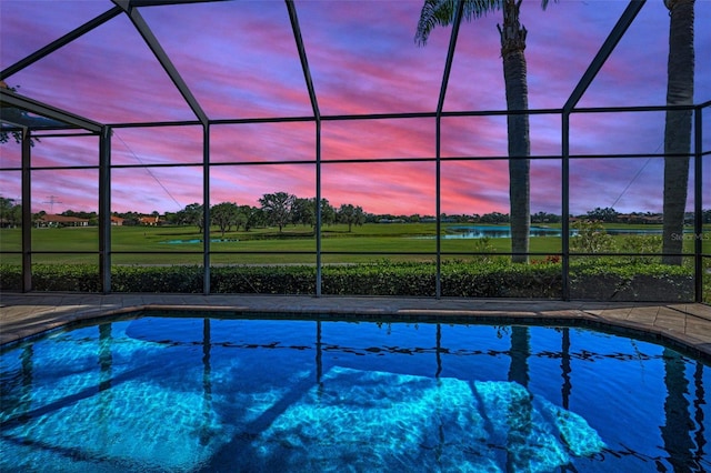 9933 Milano Dr, Trinity, FL 34655 - pool at dusk featuring an outdoor pool, a lanai, and golf course view