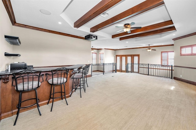 9933 Milano Dr, Trinity, FL 34655 - dining room with ornamental molding, ceiling fan, beam ceiling, light colored carpet, and baseboards