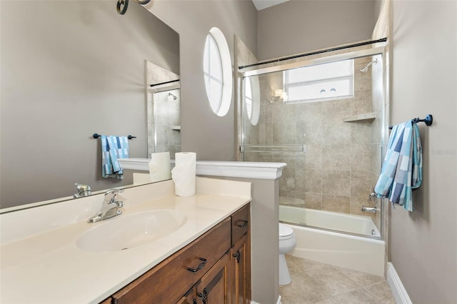 9933 Milano Dr, Trinity, FL 34655 - bathroom with toilet, tile patterned floors, bath / shower combo with glass door, and vanity