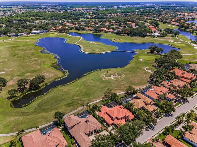 9933 Milano Dr, Trinity, FL 34655 - aerial perspective of suburban area with a local golf course and a nearby body of water
