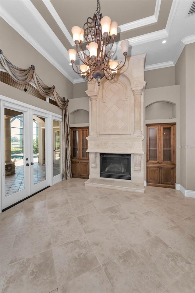 9933 Milano Dr, Trinity, FL 34655 - unfurnished living room featuring a tray ceiling, a chandelier, ornamental molding, a premium fireplace, and light tile patterned floors