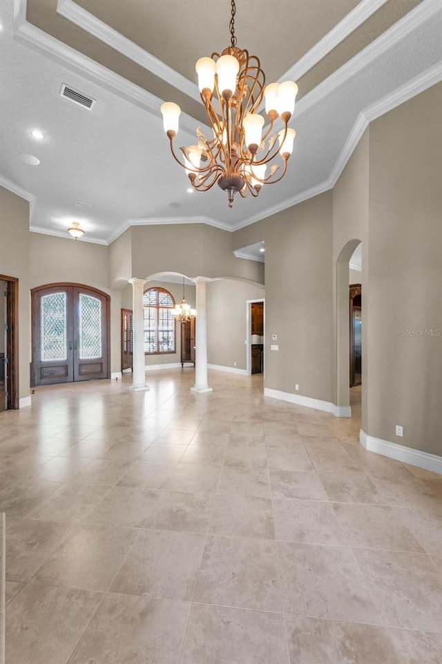 9933 Milano Dr, Trinity, FL 34655 - unfurnished living room featuring arched walkways, a chandelier, french doors, ornamental molding, and baseboards