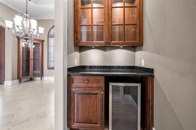 9933 Milano Dr, Trinity, FL 34655 - indoor dry bar with beverage cooler, a chandelier, baseboards, and pendant lighting