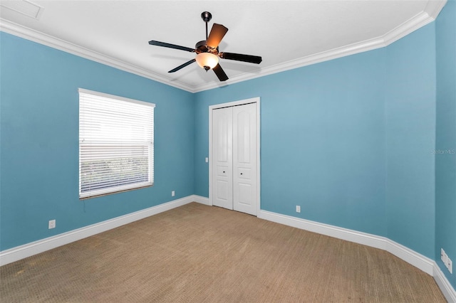 9933 Milano Dr, Trinity, FL 34655 - unfurnished bedroom with ornamental molding, carpet floors, a closet, baseboards, and ceiling fan